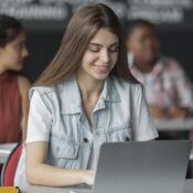 Student analyzing data in Power BI class environment