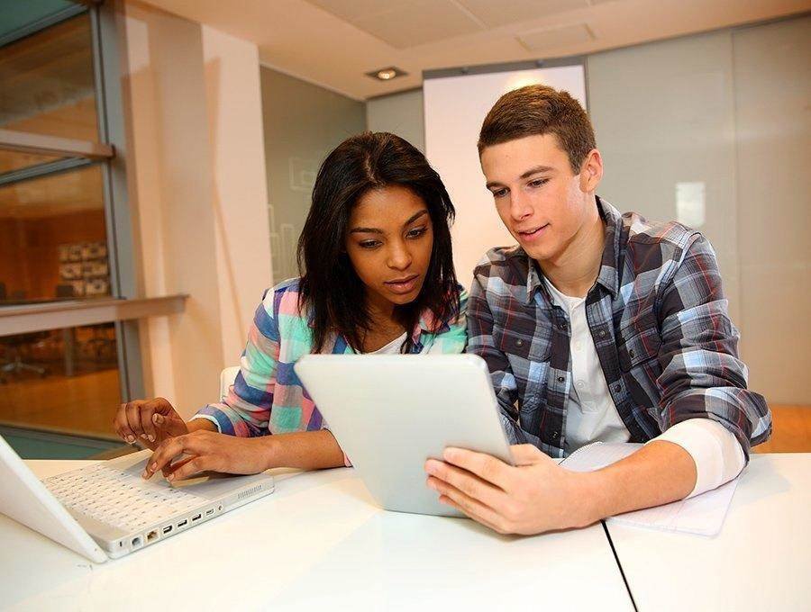 Group of students discussing project in class